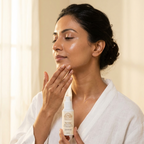 Woman smoothing Norvia Co. Renew Retinol Alternative Serum along her jawline