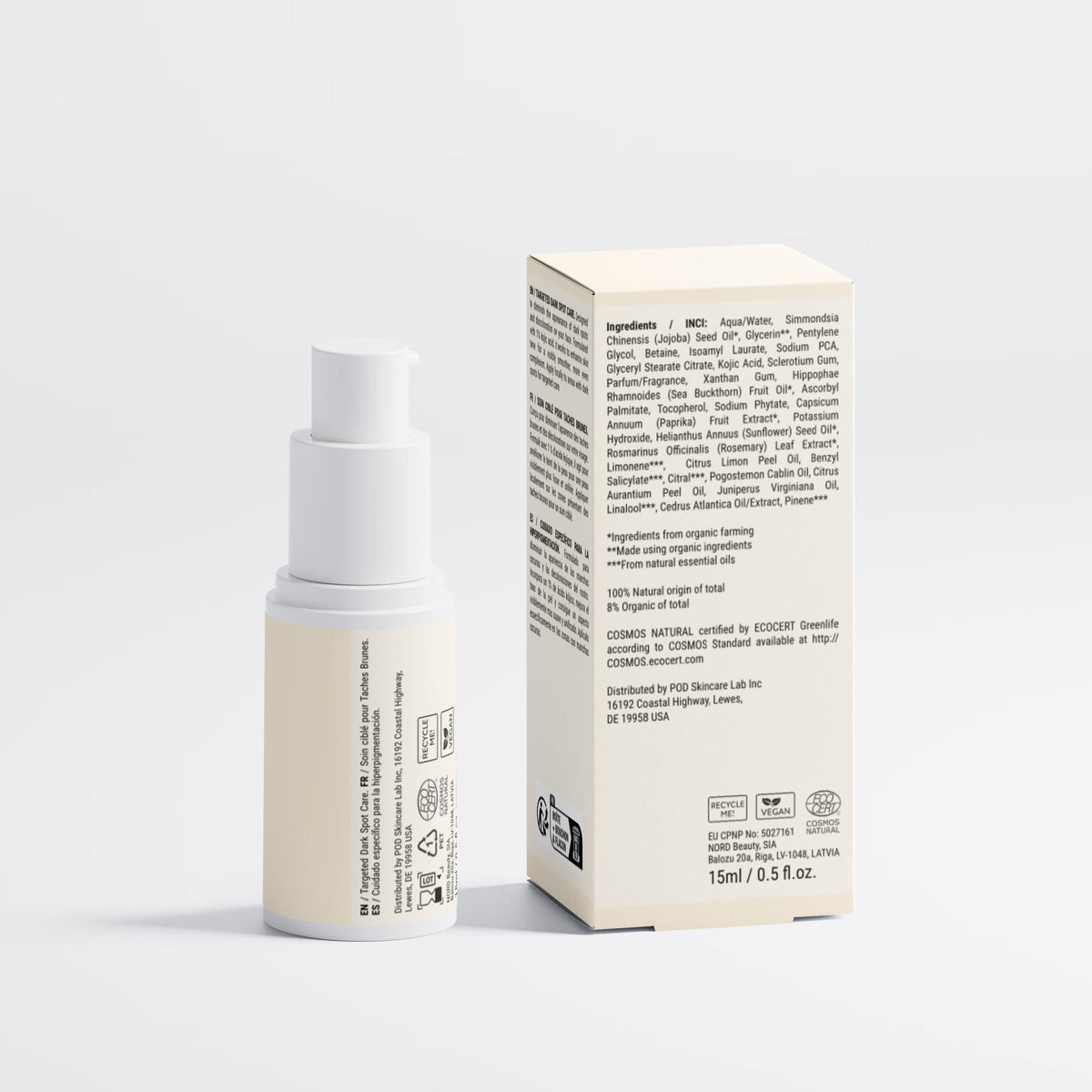 A small cylindrical cosmetic bottle with a white pump stands beside its tall rectangular box on a clean light gray studio background. Both the bottle and box are a warm off-white/cream color with black printed text and small icons.