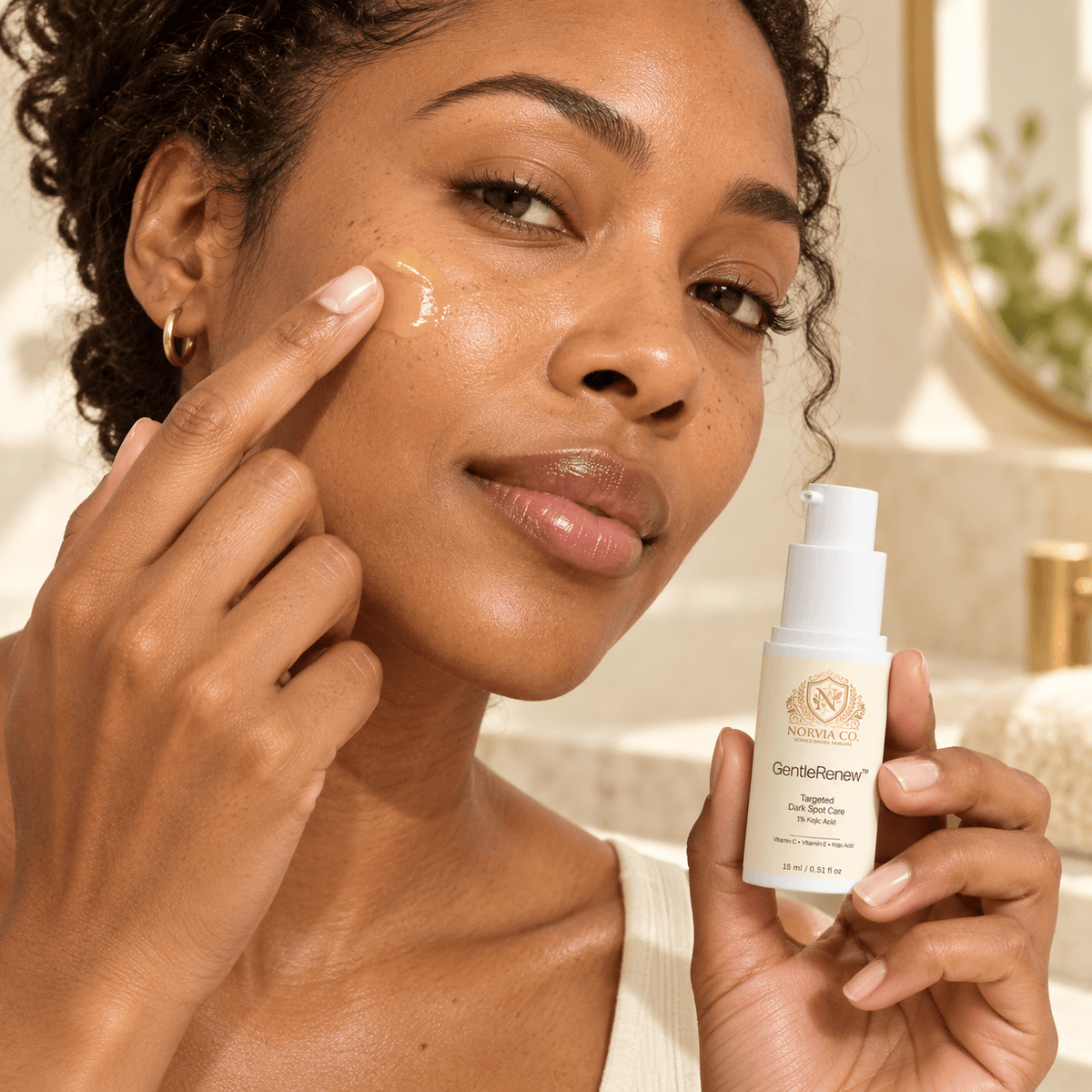 Dark spot treatment with 1 Kojic Acid in a white pump bottle, shown applied to the cheek with a clear serum texture