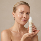 Woman with fresh dewy skin holding Norvia Co. Clear Niacinamide Gel