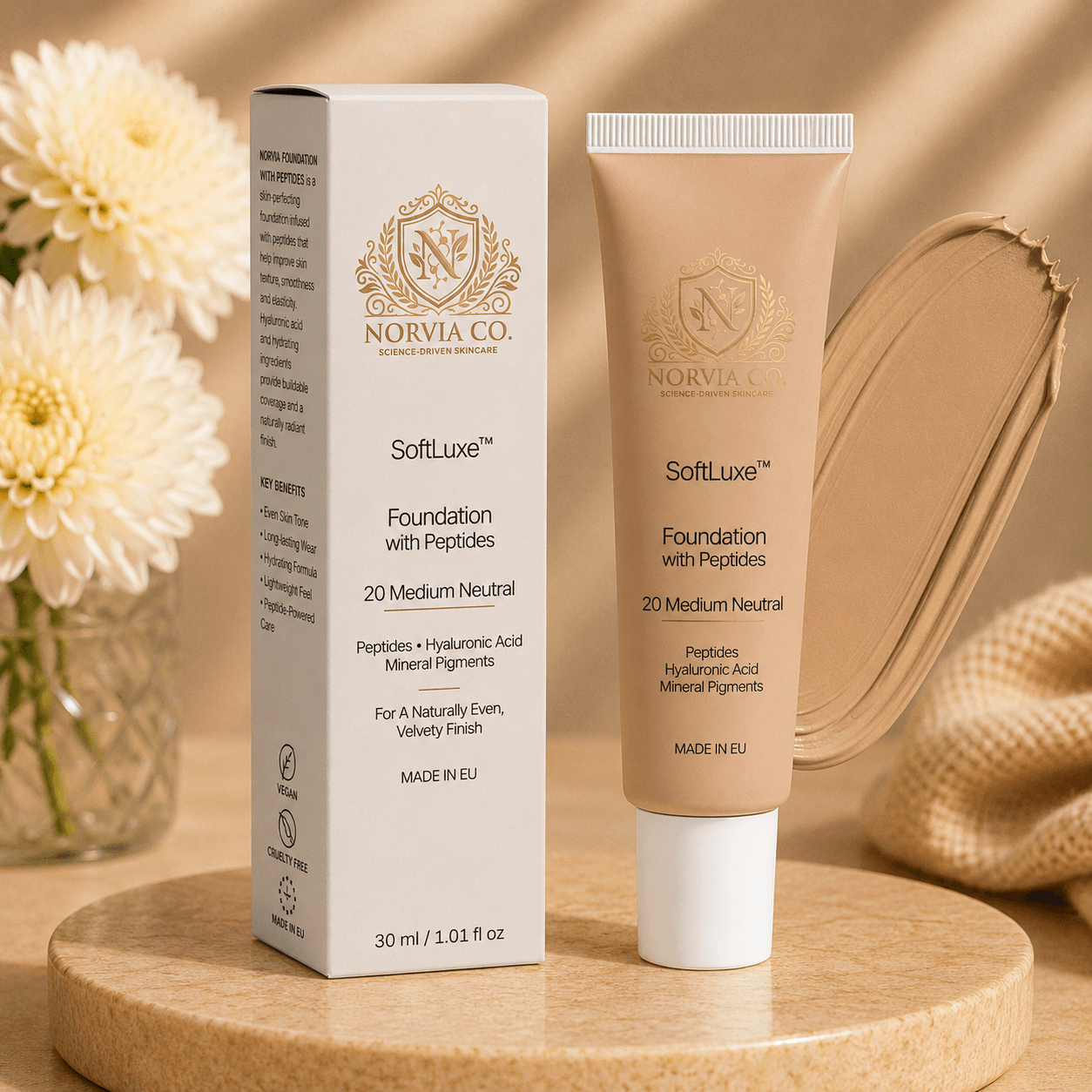 SoftLuxe Foundation with Peptides bottle and drop of liquid foundation on white background