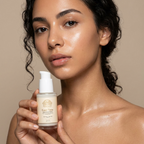 Alpha-Arbutin Serum in a clear bottle with a white pump and cream label, held by a model
