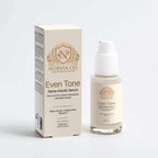 Alpha-Arbutin Serum in a cream-colored glass pump bottle with matching box, gold detailing and an Even Tone label.