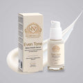 Alpha-Arbutin Serum in a cream-colored glass pump bottle with a matching box, gold Norvia branding and Even Tone label