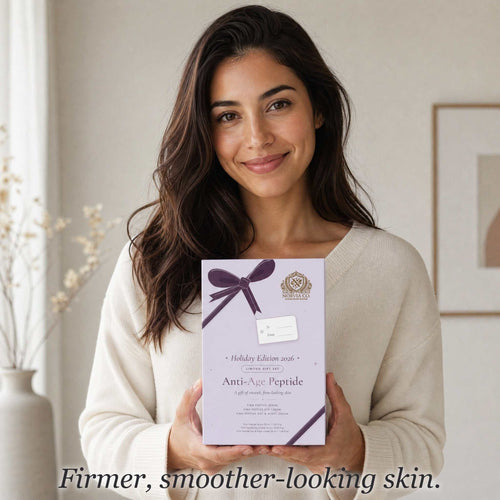 Woman holding the Norvia Co. Anti-Age Peptide holiday gift box, text: Firmer, smoother-looking skin.