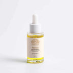 Bakuchiol Oil in a clear glass dropper bottle with golden facial oil, white cap and cream Renew label