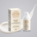Brightening Eye Cream in a cream-colored Norvia Co. carton and white pump bottle with gold botanical branding
