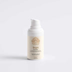 Brightening Eye Cream in a white cylindrical pump bottle with a cream label, gold crest, and botanical detailing.
