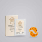 Caffeine Eye Patches in orange hydrogel crescent shapes beside cream and white Bright Energizing Eye Patches packaging