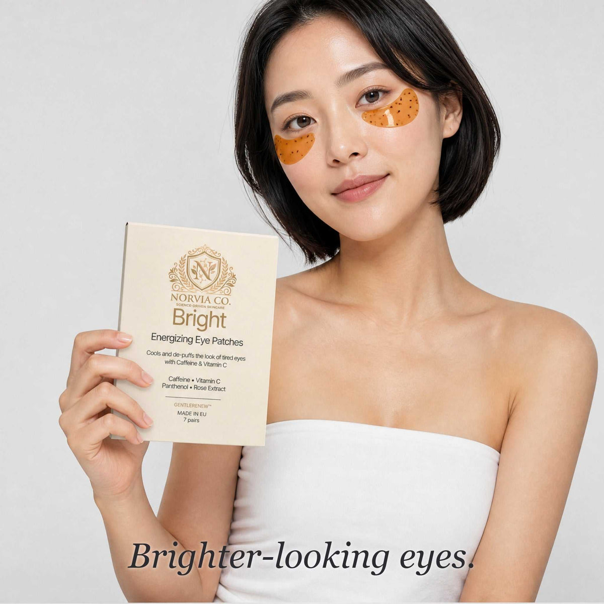Caffeine Eye Patches are orange hydrogel under-eye patches worn with a cream Bright Energizing Eye Patches box