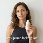 Daily Moisturizer for Dry Skin in a pale cream pump bottle held by a woman, with a simple botanical label