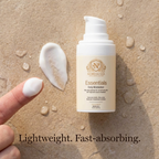 Daily Moisturizer for Dry Skin in a white pump bottle with a cream and gold label, shown with a silky white cream texture