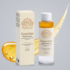 Norvia Co. Essentials Makeup Remover, a fragrance-free makeup remover, bottle and box in front of a golden oil swoosh