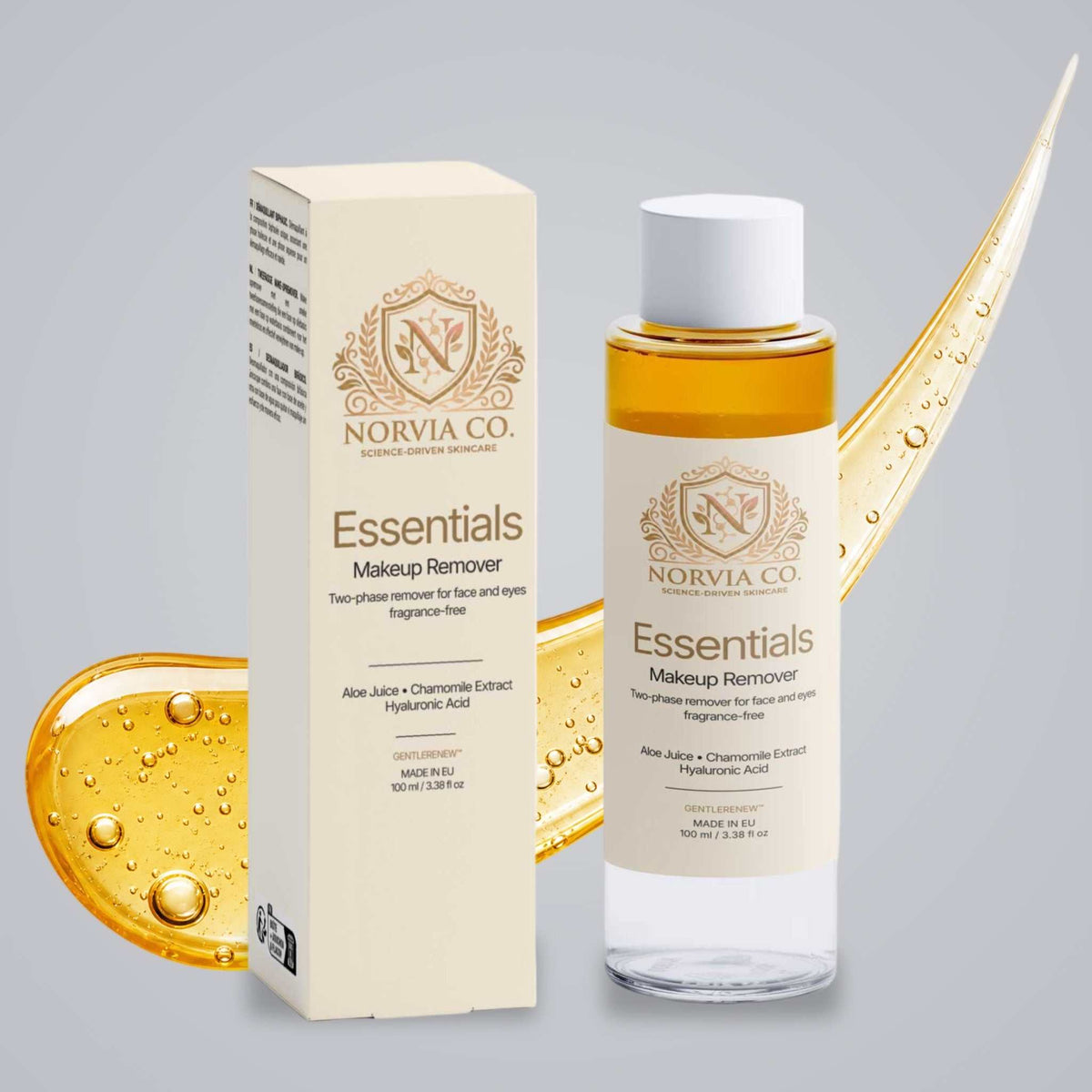 Norvia Co. Essentials Makeup Remover, a fragrance-free makeup remover, bottle and box in front of a golden oil swoosh