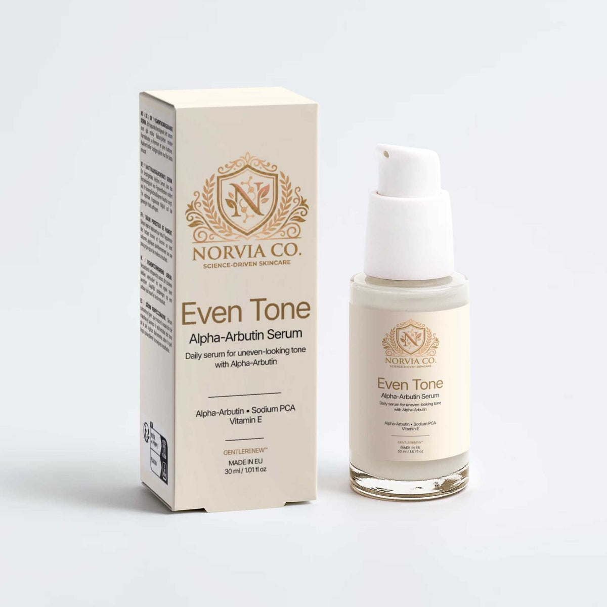 Even Tone Routine Set with a cream Alpha-Arbutin serum bottle and matching box, featuring gold lettering and a pump top.