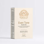 Skincare serum set in a cream and gold box, featuring the Even Tone Routine Set name and ornate crest logo.