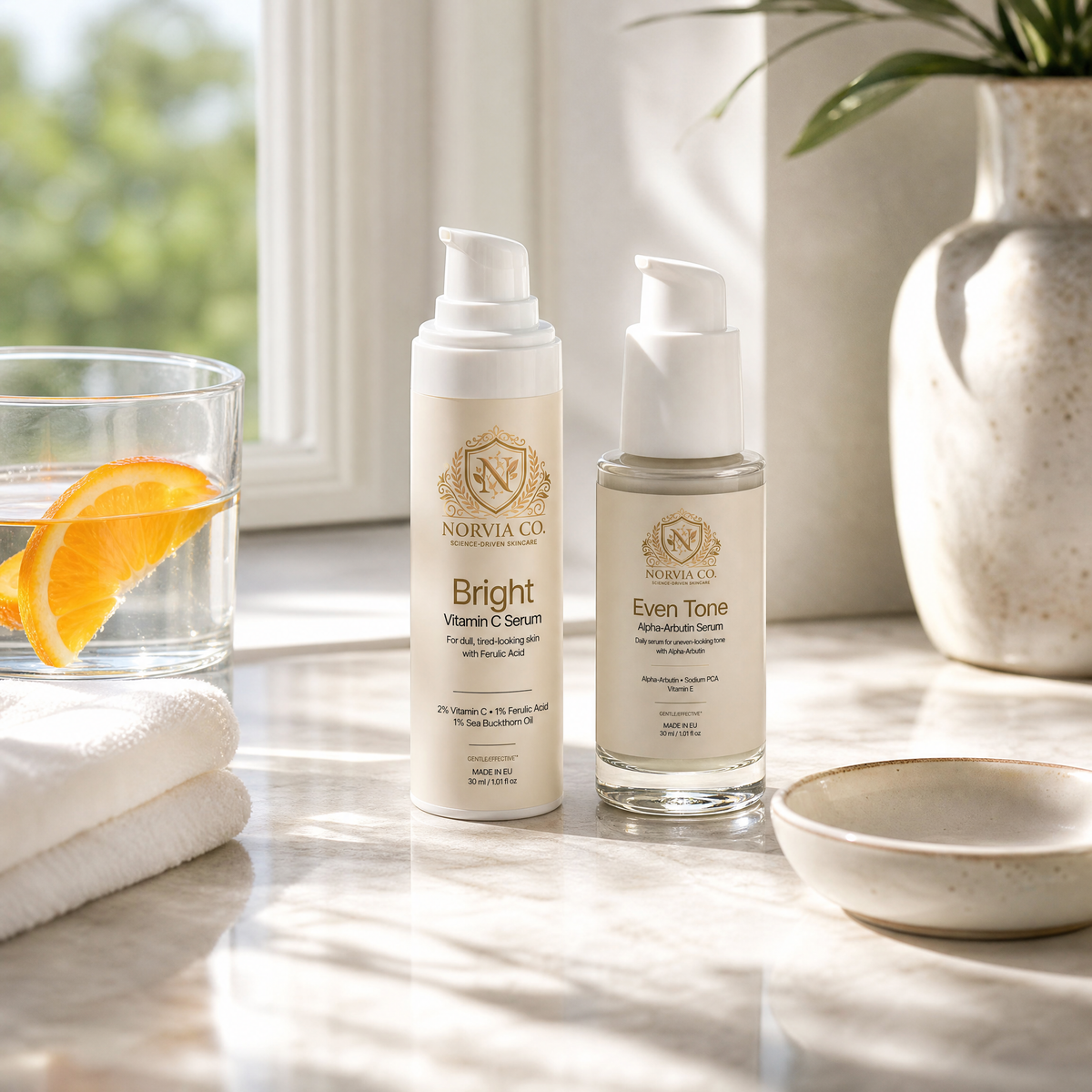 Norvia Co. Even Tone Routine Set serums on a sunny bathroom ledge