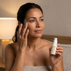 Eye Serum for Fine Lines in a white pump bottle, held by a woman gently applying serum beneath her eye