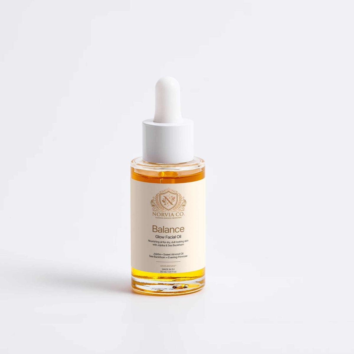 Facial Oil for Dry Skin in a clear glass dropper bottle, amber-gold oil, white cap and cream Balance label.