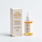 A bottle of Norvia Co. Balance Glow Facial Oil next to its cream-colored packaging box, set against a clean white background.