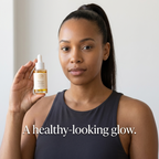 Woman holding Norvia Co. Balance Glow Facial Oil – a healthy-looking glow