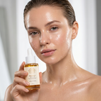 Woman with dewy glass skin holding Norvia Co. Balance Glow Facial Oil