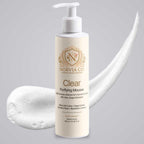 Foam Cleanser for Oily Skin in a cream pump bottle with gold lettering, shown with a white airy mousse swirl.