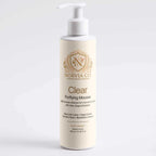 Foam Cleanser for Oily Skin in a tall ivory bottle with a white pump and gold Clear Purifying Mousse label