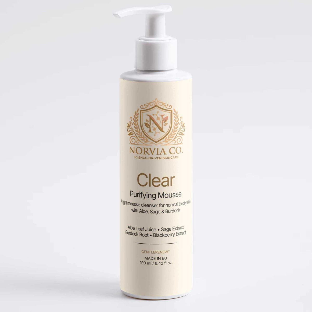 Foam Cleanser for Oily Skin in a tall ivory bottle with a white pump and gold Clear Purifying Mousse label
