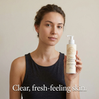Foam Cleanser for Oily Skin in a white pump bottle held beside a woman, with a beige label and gold details