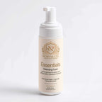 Gentle Foaming Cleanser in a cream-colored bottle with a white pump and gold Norvia Essentials label
