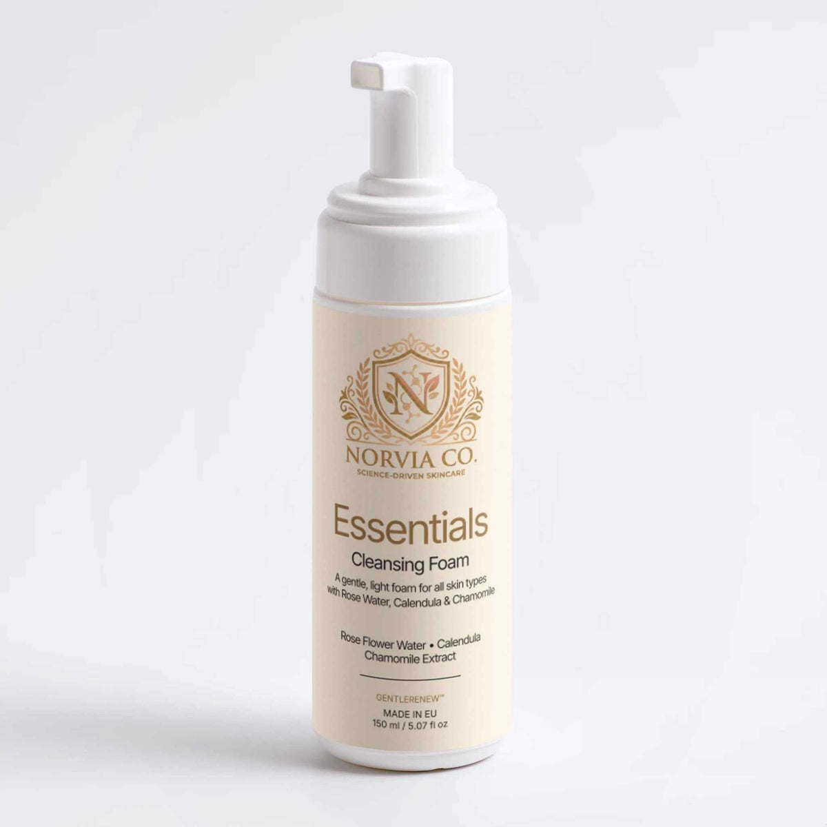 Gentle Foaming Cleanser in a cream-colored bottle with a white pump and gold Norvia Essentials label