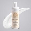 Gentle Foaming Cleanser in a white pump bottle with a cream label, gold botanical emblem, and white foam.
