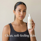 Gentle Foaming Cleanser in a white pump bottle with beige floral label, held by a woman in a dark sleeveless top
