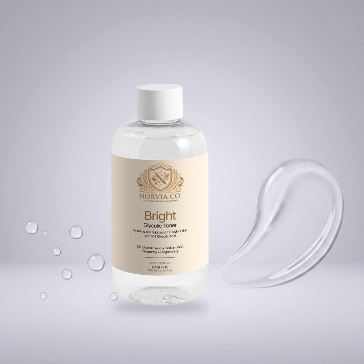 Glycolic Acid Toner in a clear bottle with a cream label, gold detailing, and white cap