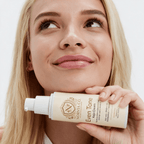 Kojic Acid Cream in a cream-colored Norvia bottle with a white pump and brown Even Tone label, held in hand