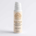Kojic Acid Scrub in a cream-colored pump bottle with gold Norvia branding and Even Tone Kojic Exfoliator label
