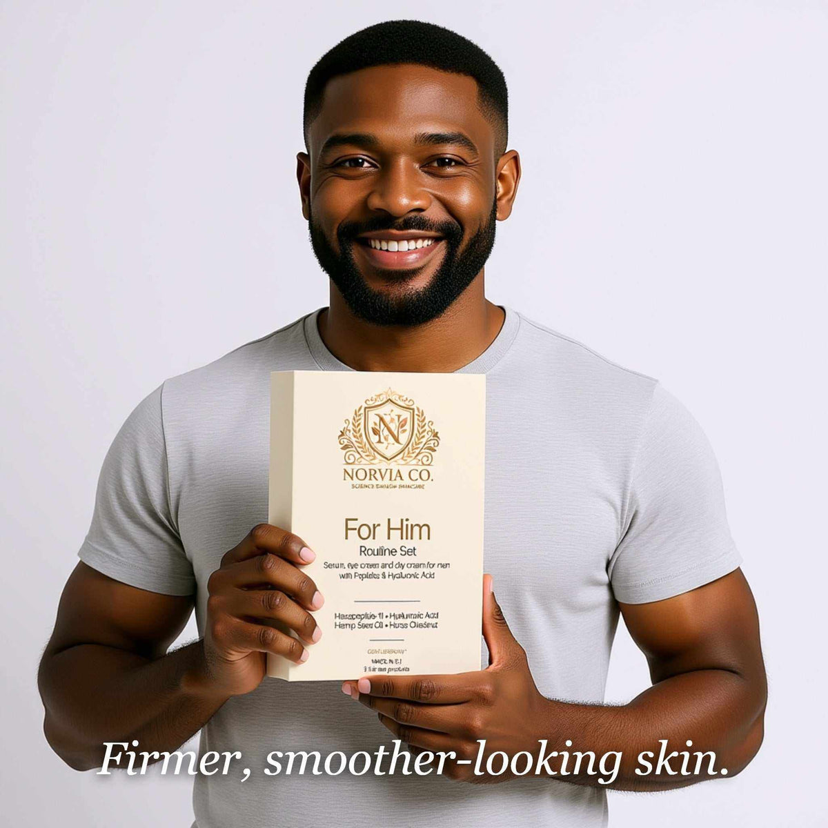 Men's Skincare Set in a cream-colored gift box with gold lettering, held by a smiling man wearing a white shirt.