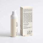Skincare bottle and box on a light gray background