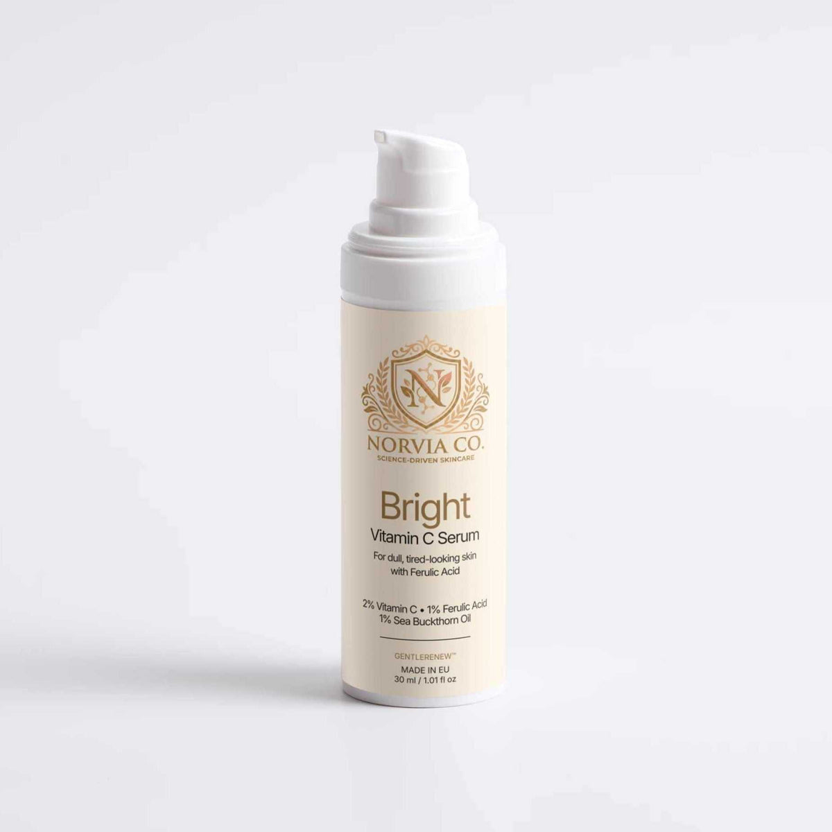 Vitamin C Serum in a cream-colored cylindrical pump bottle with a white dispenser and gold Norvia label
